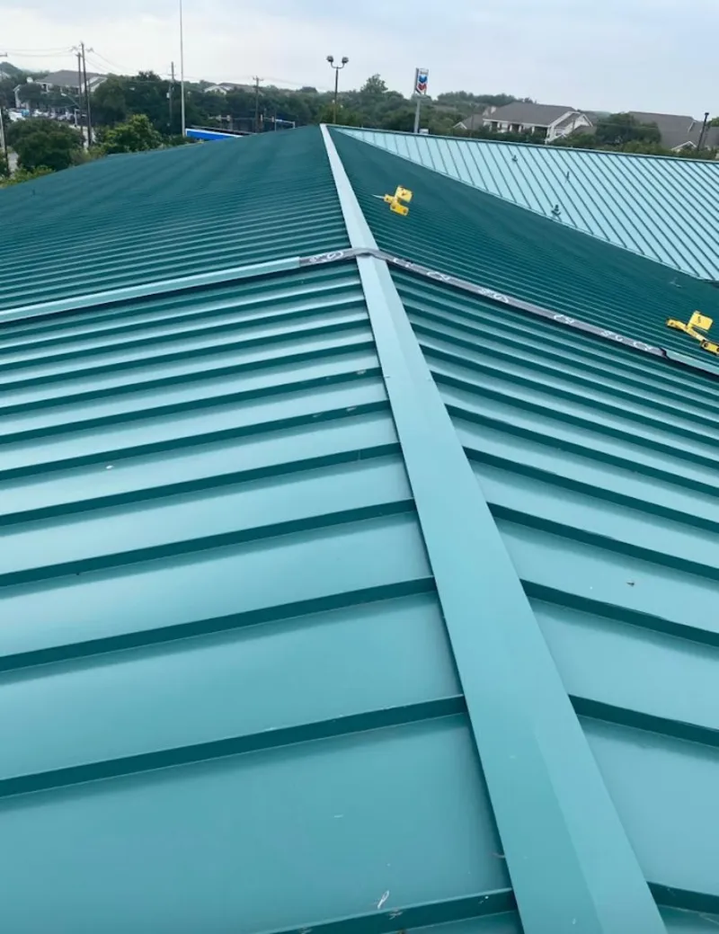 Green commercial metal roof ridge and valley for Metal Roof Repair in Inver Grove Heights
