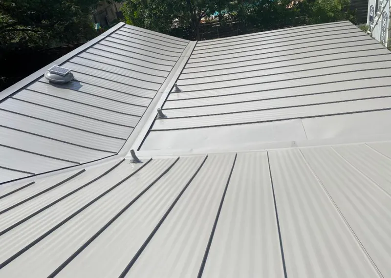 Solar attic fan installed on a metal roof for Roof Ventilation in Inver Grove Heights
