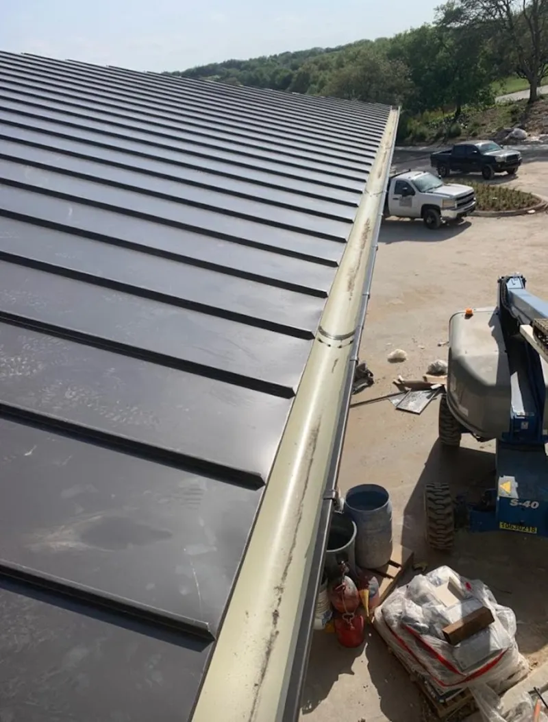 Standing seam panel and gutter detail on a metal roofing jobsite in Inver Grove Heights